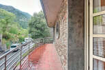 Discover a charming property with a stunning balcony overlooking a picturesque mountain view.