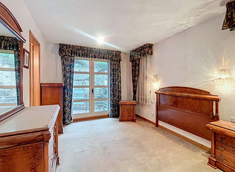Elegant bedroom with classic wooden furniture.