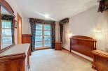 Elegant bedroom with classic wooden furniture.