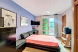 This bedroom offers a cozy retreat with a touch of elegance.