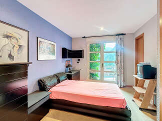This bedroom offers a cozy retreat with a touch of elegance.