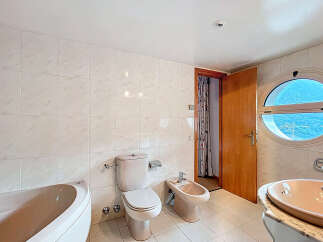 Discover a bright and airy bathroom with stunning views.