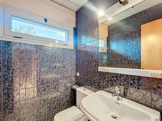 Discover a stylish bathroom featuring a modern sink and a sleek toilet.