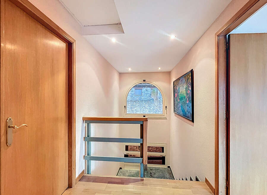 Discover a charming hallway with a unique architectural design.