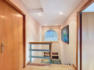 Discover a charming hallway with a unique architectural design.