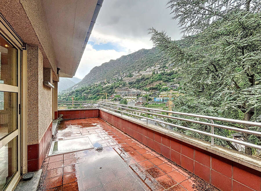 Enjoy breathtaking mountain views from this stunning balcony.