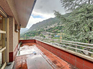 Enjoy breathtaking mountain views from this stunning balcony.