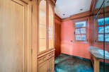 Discover the charm of this property, featuring elegant wooden cabinetry and a stylish display cabinet.
