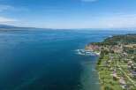 Discover waterfront properties with stunning views of the crystal-clear lake and lush greenery.