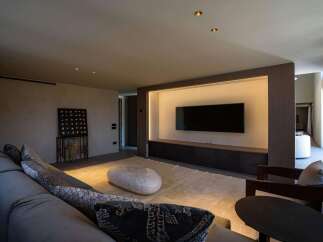This stylish living room features a neutral color palette, creating a calming atmosphere.