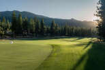 Nestled within a verdant landscape, this pristine golf course offers an idyllic retreat for luxury homeowners.
