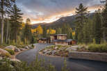 Nestled amidst a picturesque forest, this modern mountain home offers a tranquil retreat with stunning views.