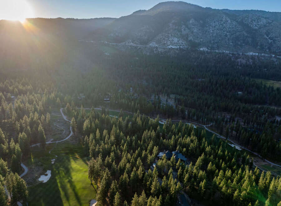 Nestled within a lush forest landscape, this property offers a serene retreat with stunning mountain views.