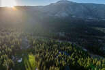 Nestled within a lush forest landscape, this property offers a serene retreat with stunning mountain views.