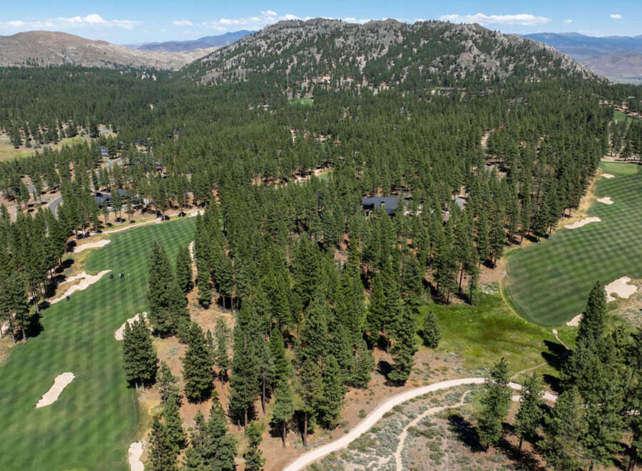 Nestled amidst towering pines and rolling hills, this property offers a tranquil retreat with stunning natural beauty.
