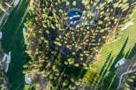 An aerial view shows a luxury home nestled within a golf course community.