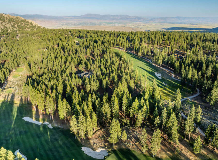 Nestled within a serene forest setting, this property offers unparalleled privacy and tranquility.