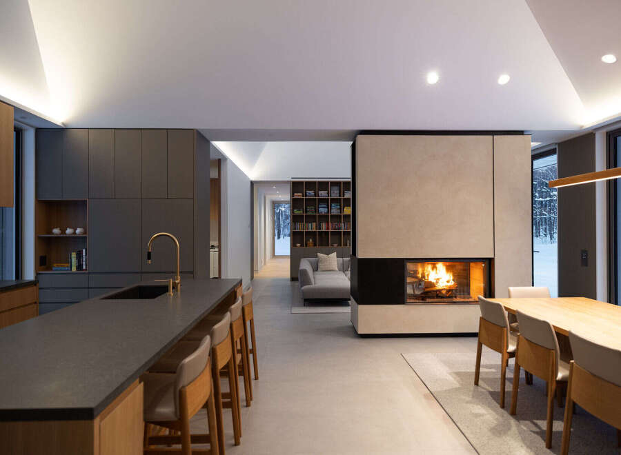 This stunning modern home boasts an open-concept design, seamlessly blending the kitchen, living, and dining areas.