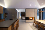This stunning modern home boasts an open-concept design, seamlessly blending the kitchen, living, and dining areas.