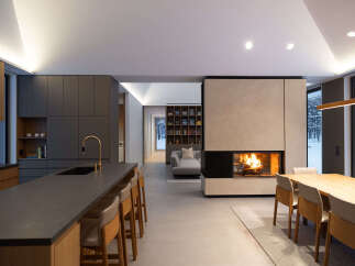 This stunning modern home boasts an open-concept design, seamlessly blending the kitchen, living, and dining areas.