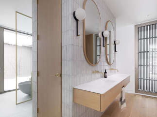 This stunning bathroom boasts a modern design with sleek, minimalist features.