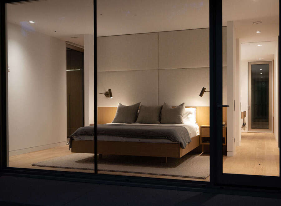 Step into luxury with this stunning bedroom, showcasing a modern design and serene ambiance.