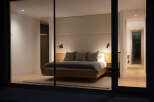 Step into luxury with this stunning bedroom, showcasing a modern design and serene ambiance.