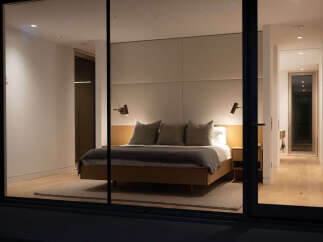 Step into luxury with this stunning bedroom, showcasing a modern design and serene ambiance.