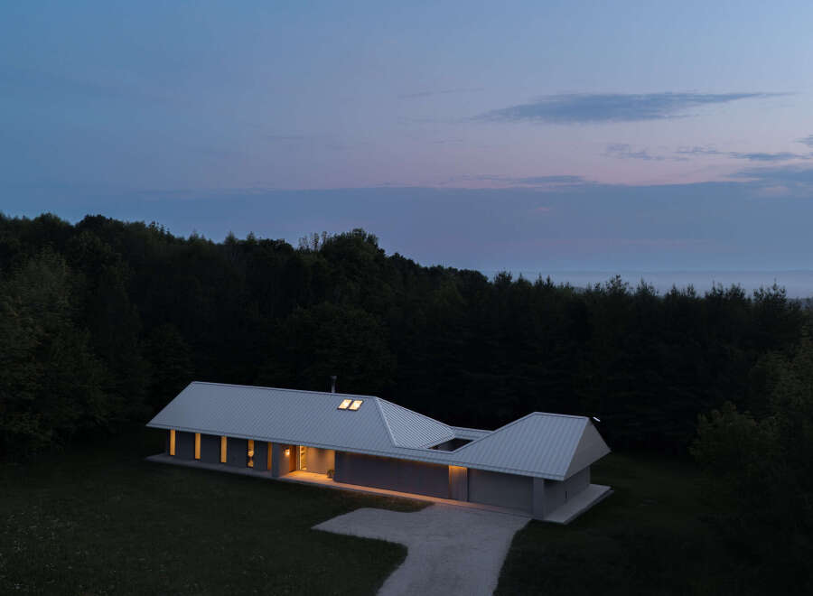 This stunning modern home offers a serene escape with its sleek design and natural surroundings.