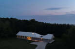 This stunning modern home offers a serene escape with its sleek design and natural surroundings.