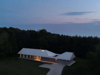 This stunning modern home offers a serene escape with its sleek design and natural surroundings.