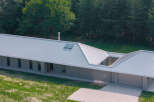 This modern home boasts a sleek, contemporary design with a striking metal roof.