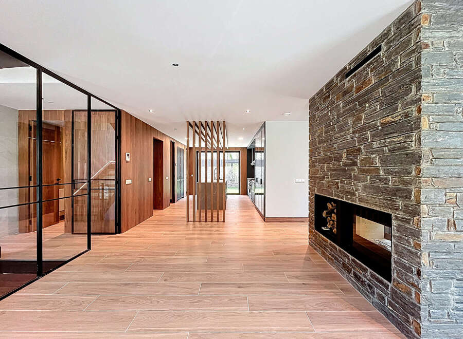 Step inside this stunning property featuring a grand foyer with sleek, modern design elements.