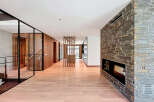 Step inside this stunning property featuring a grand foyer with sleek, modern design elements.