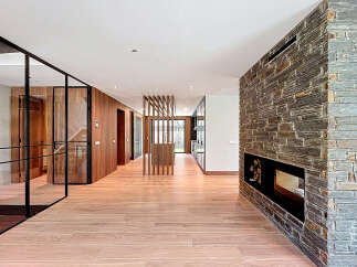 Step inside this stunning property featuring a grand foyer with sleek, modern design elements.