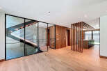 This property boasts an open-concept design with striking architectural elements.