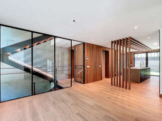 This property boasts an open-concept design with striking architectural elements.