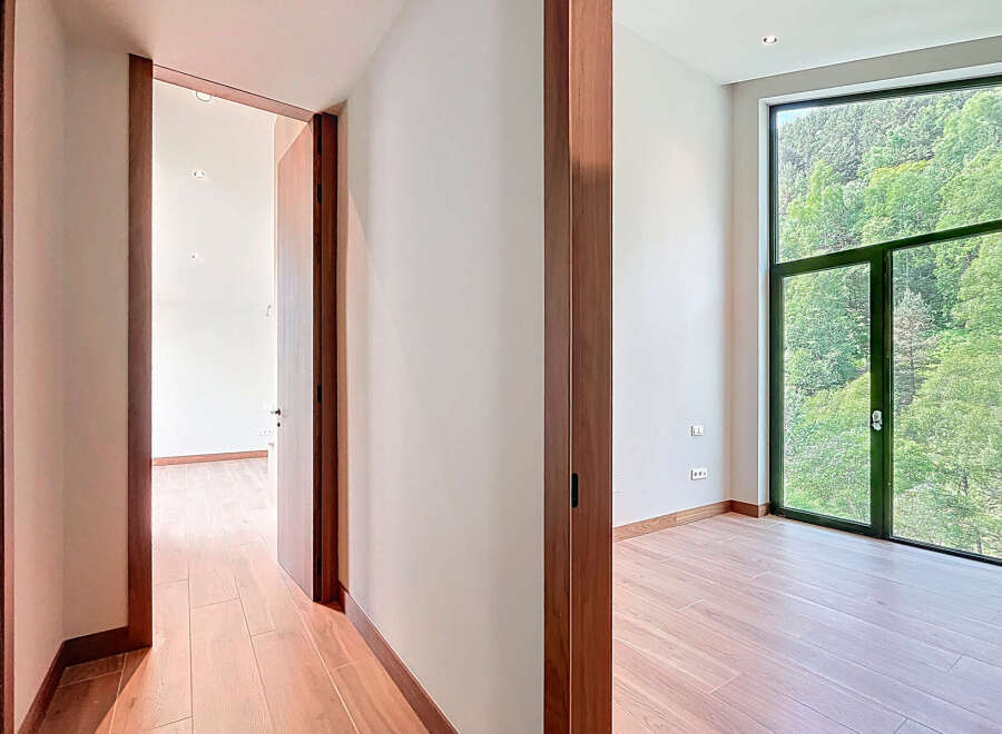 Discover an immaculate interior with hardwood flooring and modern design.