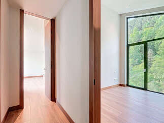 Discover an immaculate interior with hardwood flooring and modern design.