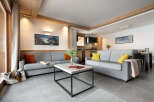 This inviting living room features two comfortable gray sofas, a modern coffee table, and stylish décor.