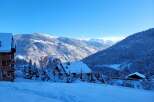 A charming ski chalet nestled in a snow-covered alpine landscape, perfect for winter getaways.