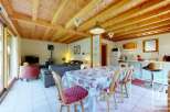 This inviting chalet features a spacious open-plan living and dining area, perfect for family gatherings.