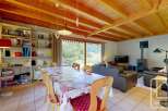 This inviting chalet features a spacious open-plan living and dining area, perfect for family gatherings.