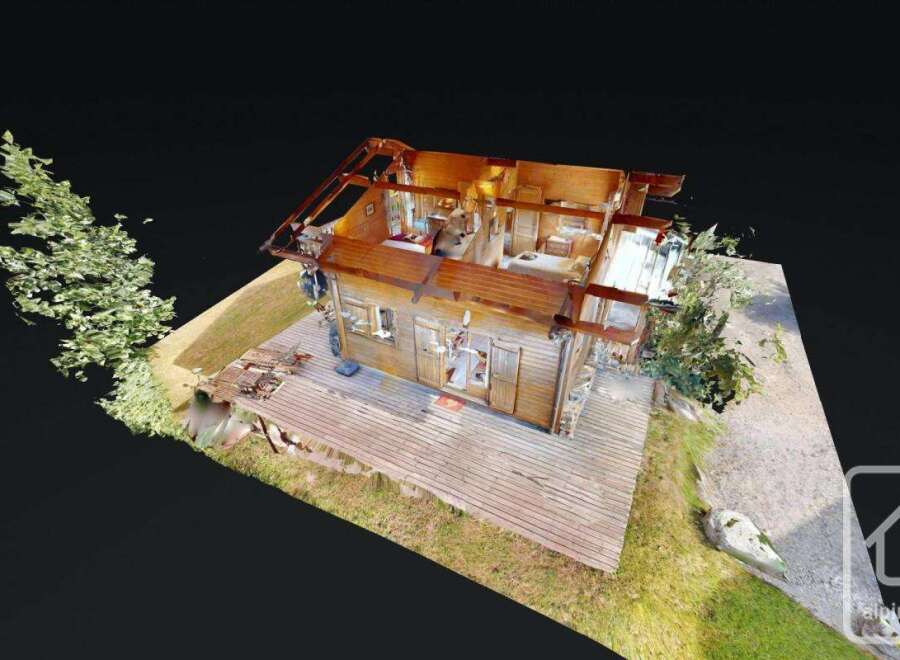 Discover this unique wooden cabin featuring an expansive outdoor deck, perfect for enjoying serene natural surroundings.