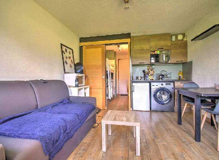 This cozy apartment features a comfortable living area with a sofa and coffee table.