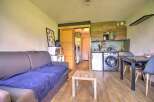 This cozy apartment features a comfortable living area with a sofa and coffee table.