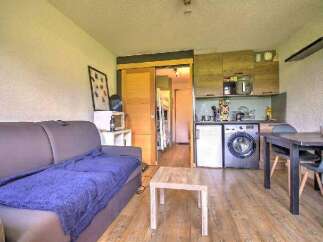 This cozy apartment features a comfortable living area with a sofa and coffee table.