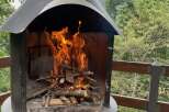 Imagine cozy evenings by this outdoor fireplace, perfect for properties with scenic views and entertainment spaces.