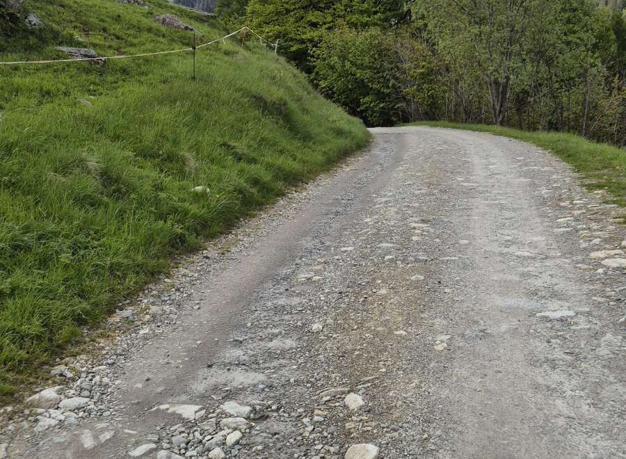 Discover unparalleled tranquility with this remote mountain property, accessible via a winding gravel road.