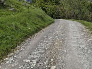Discover unparalleled tranquility with this remote mountain property, accessible via a winding gravel road.